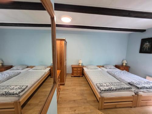 a group of four beds in a room at Zachęta in Sokolec