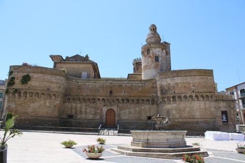 a building with a fountain in front of it at Suite in Centro in Vasto