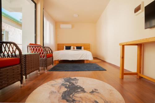 a bedroom with a bed and a table and chairs at Zuma Hotel Cyprus - Turkish Side in Nicosia