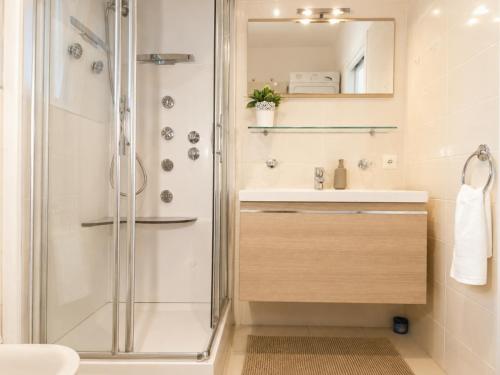 a bathroom with a shower and a sink at Emerald Apartment City Center in Lugano