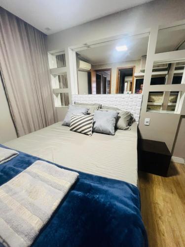 a bedroom with a bed with two pillows on it at Apartamento de 3 quartos, climatizado com lazer completo in Brasília