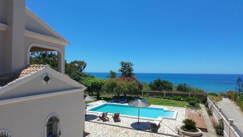 a view of a swimming pool from a house at Skidi Beach house in Ágios Matthaíos