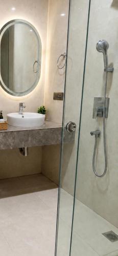 a bathroom with a shower and a sink at Galaxy Luxury Stay in Ghaziabad