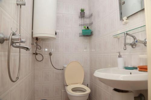 a bathroom with a toilet and a sink at Top Centre, Quiet, Independant in Burgas