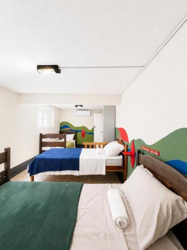 a bedroom with two beds in a room at Casa Igara Hostel in Belém
