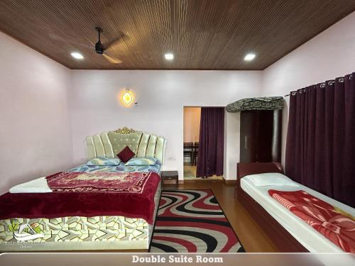 a bedroom with a bed and a chair and a rug at Greenleaf Holidays in Munnar