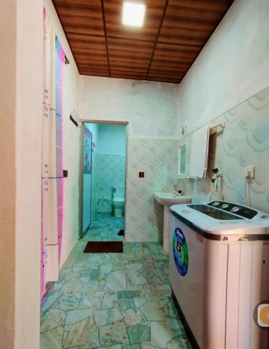 a bathroom with a sink and a toilet at Mango garden villa in Arugam Bay
