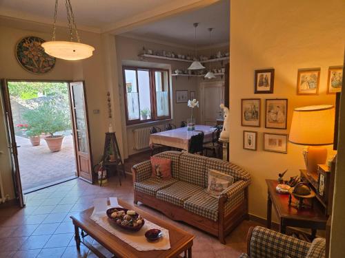 a living room with a couch and a table at La Primavera B&B in Volterra
