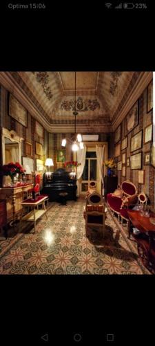 a large living room with a couch and a table at Casato Lioy in Ripacandida