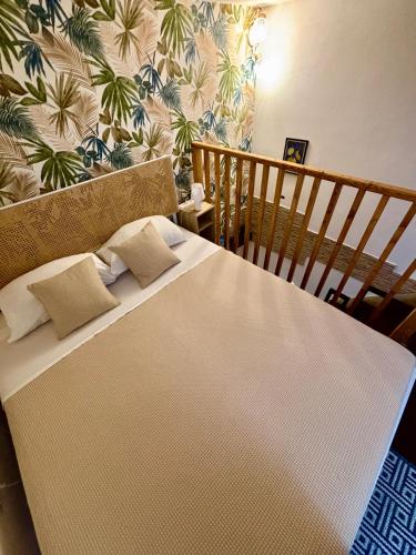 a large white bed with two pillows on top of it at Sale34 in Marsala