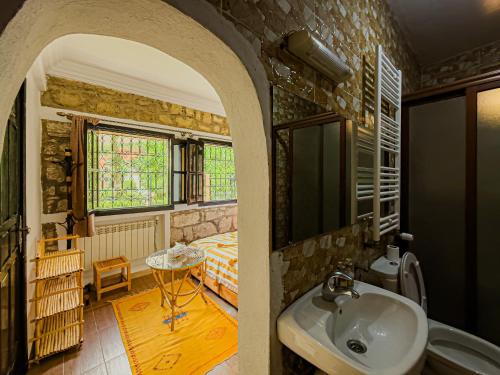 a bathroom with a sink in a room at Tonaroz House in Imlil