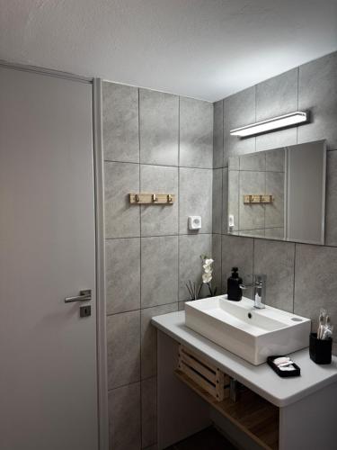 a bathroom with a sink and a mirror at Naousa Nest in Naousa