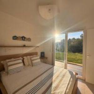 a bedroom with a large bed and a large window at Villa Horizon in Nice