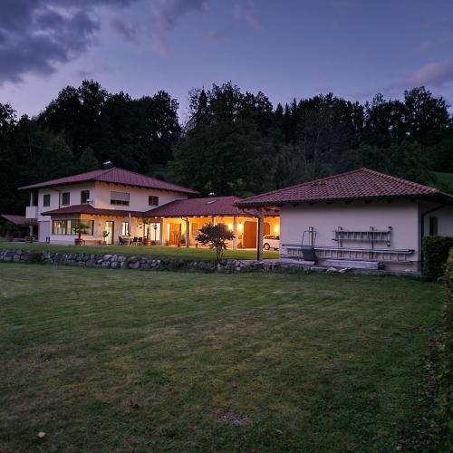 a large house with a yard in front of it at Haus Leblhuber in Windischgarsten