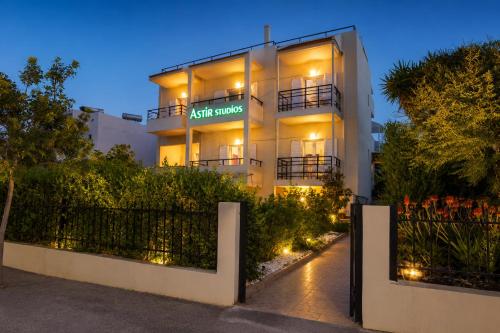 a night shot of a apartment building with lights at Astir Studios in Stalís