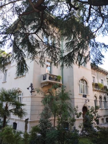 a building with a balcony on the side of it at NOBILI LIBARDI - VILLA BASEVI in Verona