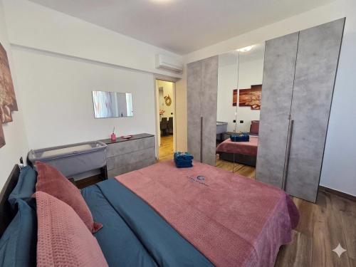 a large room with a bed and a bathroom at Appartamento LIBERTA, Liguria in Rapallo