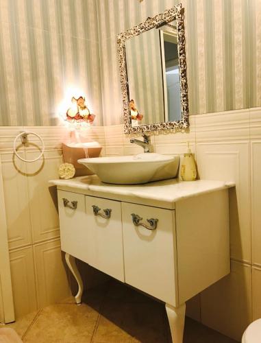 a bathroom with a sink and a mirror at Oryx Homes & Villas in Bodrum City