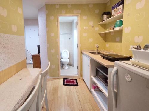 a kitchen with a sink and a toilet in a room at lumpini naklua wongamat in North Pattaya