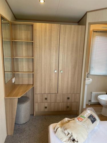 a bedroom with a bed and a sink and a toilet at Drake 17 in Scarborough