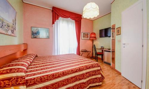 Postel nebo postele na pokoji v ubytování Hotel Benaco