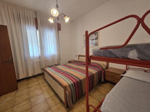 a bedroom with a bunk bed and a bunk bed at Manuela in Bibione