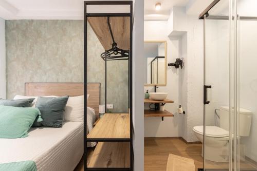 a small bedroom with a bed and a bathroom at Emarooms Boutique Laredo in Laredo