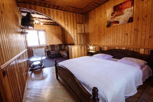 מיטה או מיטות בחדר ב-Korona Karpat