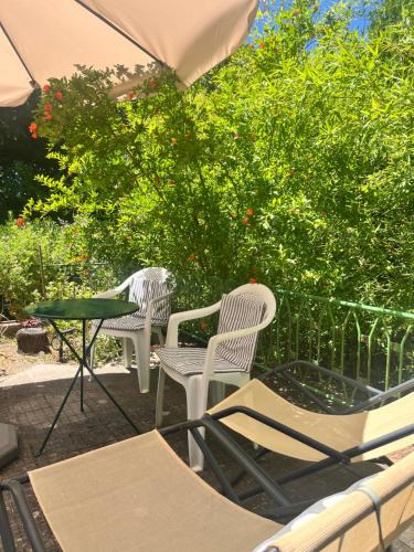 two chairs and a table on a patio at Villa Sveva in Làconi