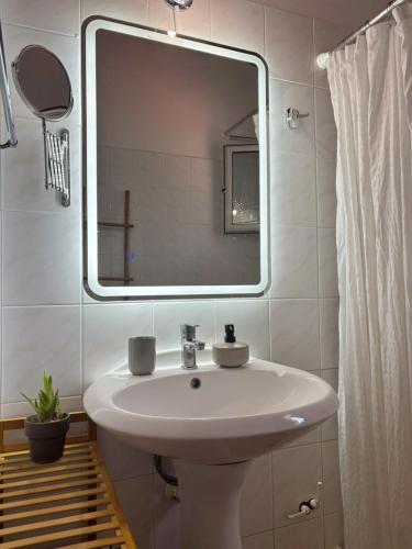 a bathroom with a sink and a mirror at Onar House IV in Achladies