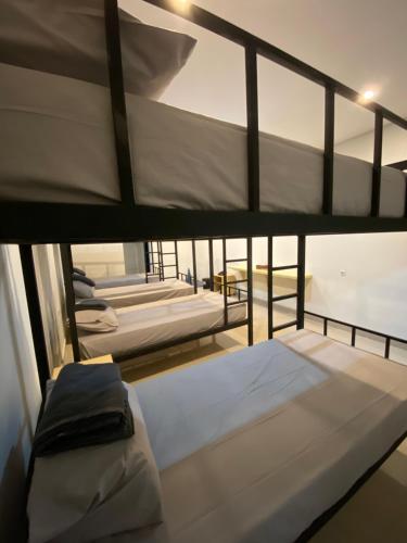 a couple of bunk beds in a room at Aisyi Tower Klaten in Klaten
