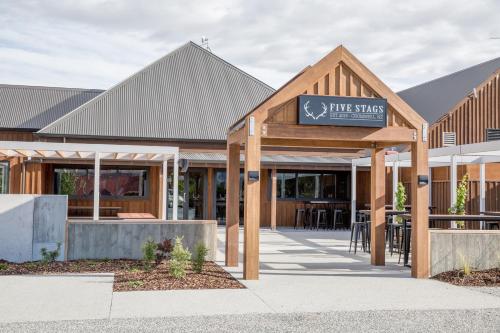a building with a sign that reads first sticks at The Harvest Hotel in Cromwell