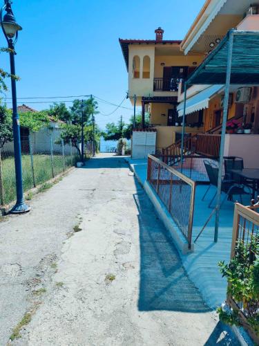 an empty street in front of a house at Barefoot Nest in Nea Skioni