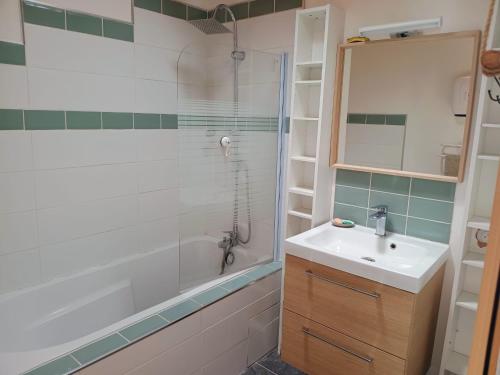 a bathroom with a sink and a shower at Chez Audrey in Courthézon