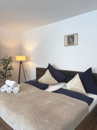 a bedroom with a bed with two pillows on it at Gartenstudio Anila in Cochem