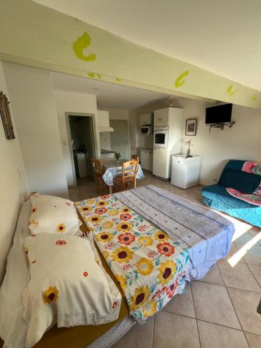a bedroom with a bed and two pillows on it at vue mer Studio 2/3 pers 1 bed + 1 cot in Farinole