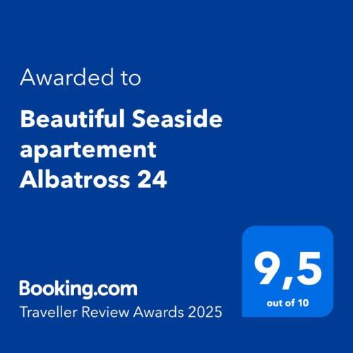 a blue sign that reads awarded to beautiful senate apartment at Beautiful Seaside apartement Albatross 24 in Ķesterciems