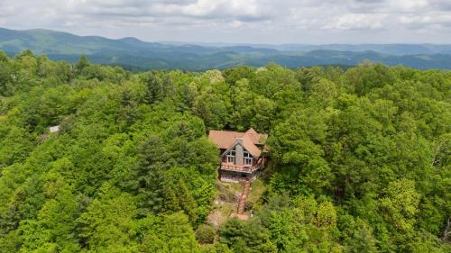 an aerial view of a house in the middle of a forest at Rockcliff Retreat in Lenoir