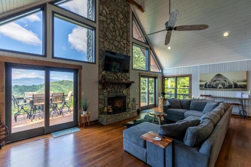 a living room with a couch and a fireplace at Rockcliff Retreat in Lenoir
