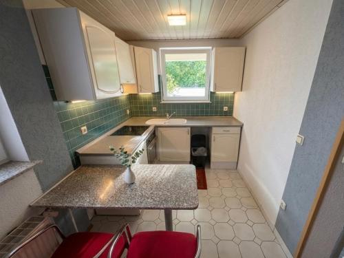 a small kitchen with a sink and a window at Hava 2 in Sarajevo