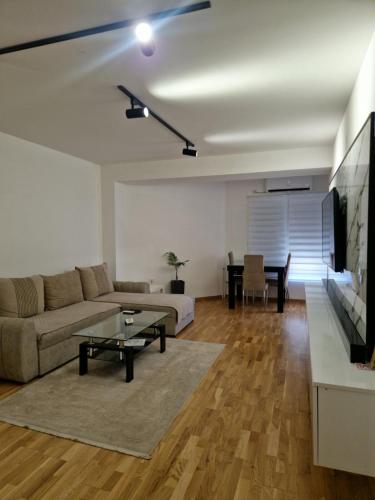 a living room with a couch and a table at Diamond Apartment in Strumica