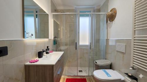 a bathroom with a shower and a sink and a toilet at Appartamento LIBERTA, Liguria in Rapallo