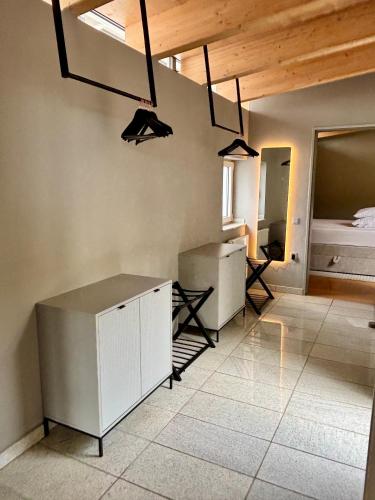 a room with a desk and a bed and lights at PaderCityLoft- lichtdurchflutet und privat mit Kamin-Dachterrasse-Sauna-Außendusche im Atrium in Paderborn