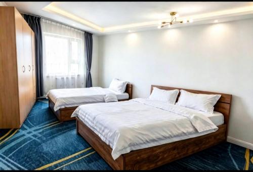 En eller flere senge i et værelse på DONI HOTEl