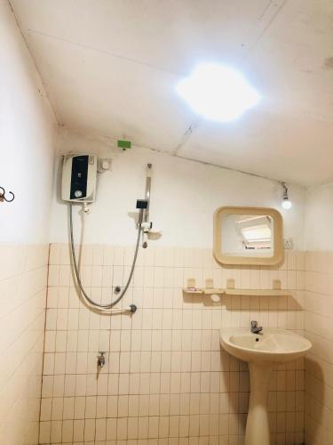 a bathroom with a shower and a sink at Casa Del Ceylon in Hikkaduwa