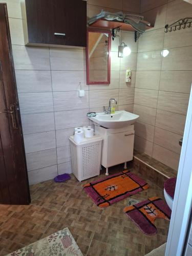 a bathroom with a sink and a mirror at Ribnica in Ribnica