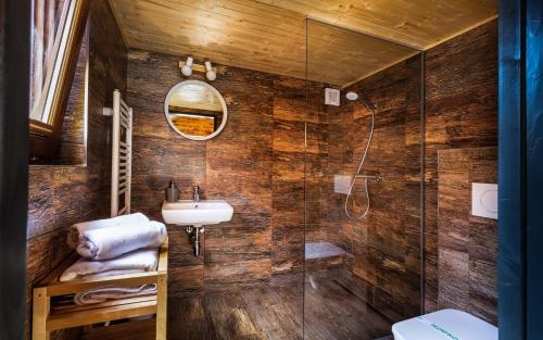 a bathroom with a sink and a shower at Villa Bellevue Wellness in Liptovský Mikuláš
