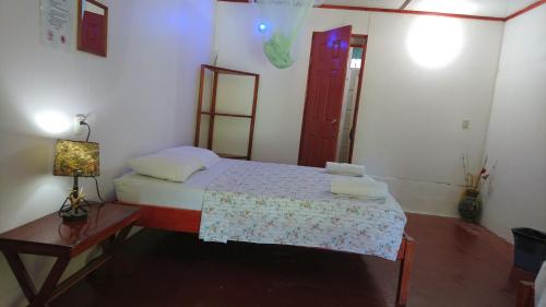 a bedroom with a bed and a table with a lamp at Mirians Place Drake in Drake