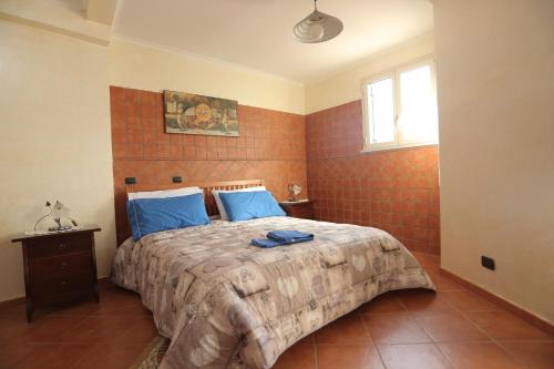 Giường trong phòng chung tại Casa Toto'