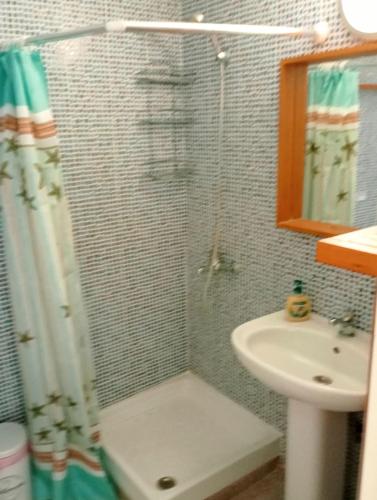 a bathroom with a shower and a sink at Avraam Apartment Polychrono in Polychrono